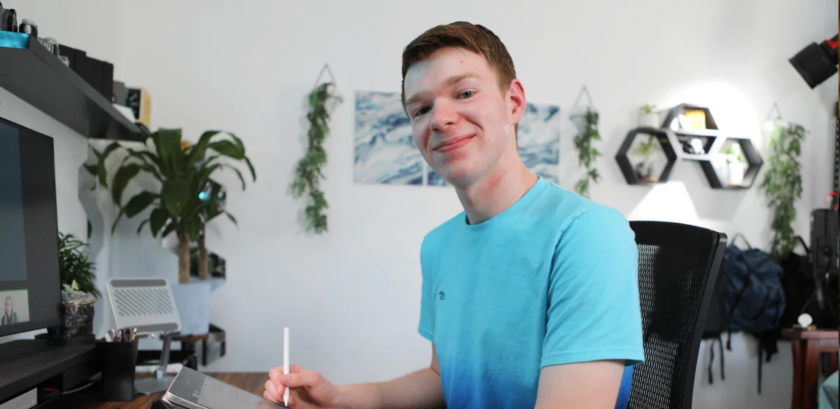 High school student taking notes wearing a light blue shirt